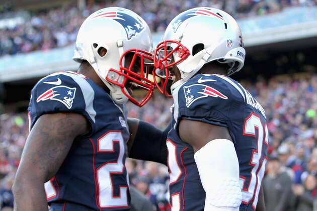FOXBORO, MA - DECEMBER 14:  Darrelle Revis #24 and Devin McCourty #32 of the New England Patriots react after McCourty broke up a pass during the first quarter against the Miami Dolphins at Gillette Stadium on December 14, 2014 in Foxboro, Massachusetts.  (Photo by Jim Rogash/Getty Images)
