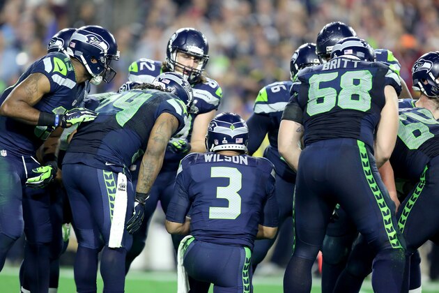 Seattle Seahawks Russell Wilson #3 leads a huddle against the New England Patriots  during the Super Bowl on Sunday, February 1, 2015 in Glendale, AZ.  (AP Photo/Gregory Payan)