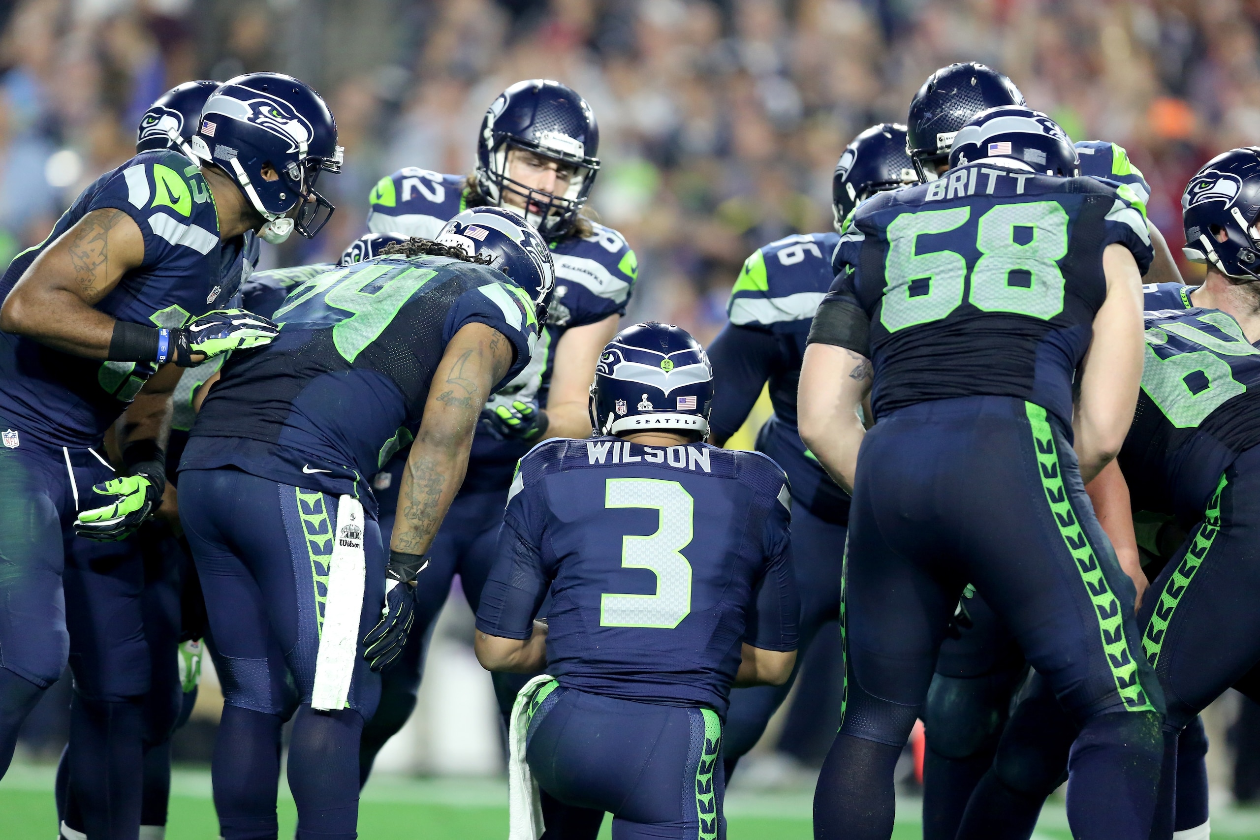 Seattle Seahawks Russell Wilson #3 leads a huddle against the New England Patriots  during the Super Bowl on Sunday, February 1, 2015 in Glendale, AZ.  (AP Photo/Gregory Payan)