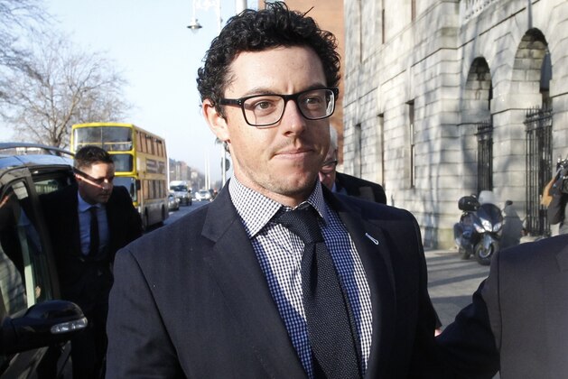 Rory McIlroy arrives at Dublin high court, Ireland, Tuesday Feb. 3, 2015.  The four-time major winner initiated the multi-million dollar case against his former management company claiming he was misled into signing a contract with the company. (AP Photo/Peter Morrison)
