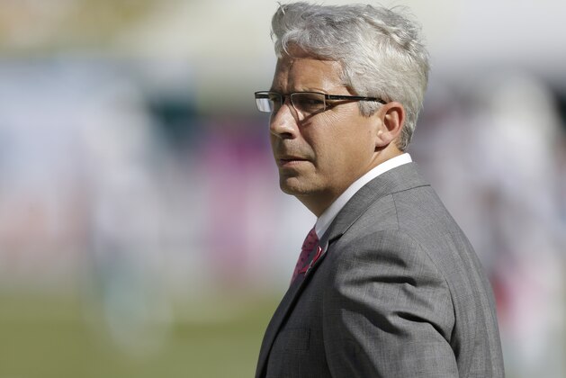 Miami Dolphins general manager Dennis Hickey looks at his team from the sidelines during the second half of an NFL football game against the Green Bay Packers, Sunday, Oct. 12, 2014, in Miami Gardens, Fla. The Packers defeat the Dolphins 27-24. (AP Photo/Wilfredo Lee)