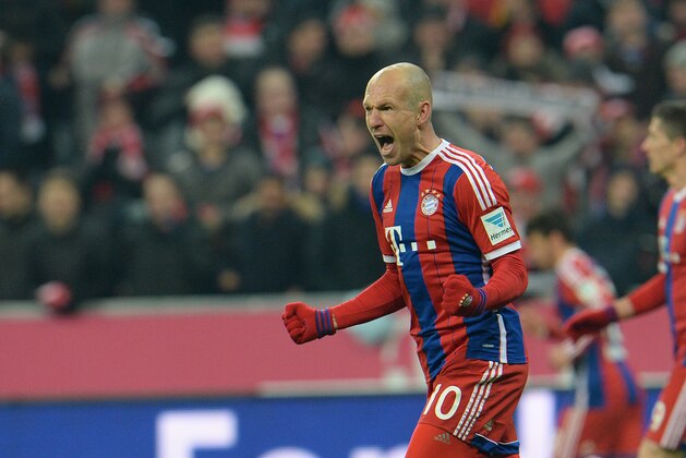 Bayern's Arjen Robben from the Netherlands celebrates after scoring during the  soccer match between FC Bayern Munich and FC Schalke in the Allianz Arena in Munich, Germany, on Tuesday, Feb.  3, 2015. (AP Photo/Kerstin Joensson)