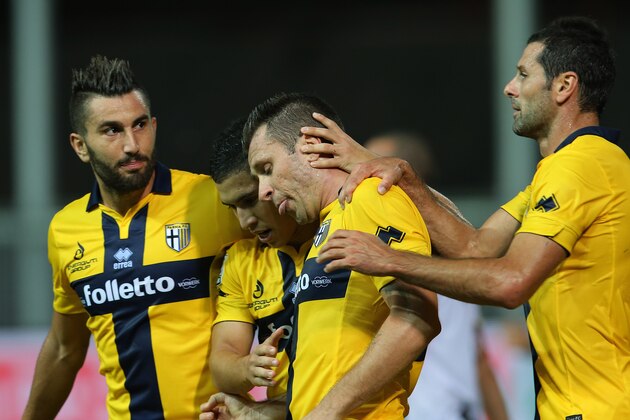 Parma's Antonio Cassano celebrates with teammates after scoring during the Serie A soccer match between Udinese and Parma at the Friuli Stadium in Udine, Italy, Monday Sept. 29, 2014. (AP Photo/Paolo Giovannini)