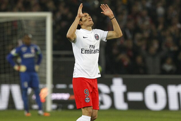 PSG's Edinson Cavani, reacts after scoring during his French League one soccer match against Lille at the Lille Metropole stadium, in Villeneuve d'Ascq, northern France, Wednesday, Dec. 3, 2014. (AP Photo/Michel Spingler)