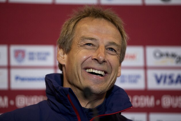 The U.S. national soccer team head coach Jurgen Klinsmann, from Germany, laughs during a press conference at Fulham's Craven Cottage stadium in London, Thursday, Nov. 13, 2014.  The U.S. are due to play Colombia in an international friendly soccer match at the stadium on Friday.  (AP Photo/Matt Dunham)