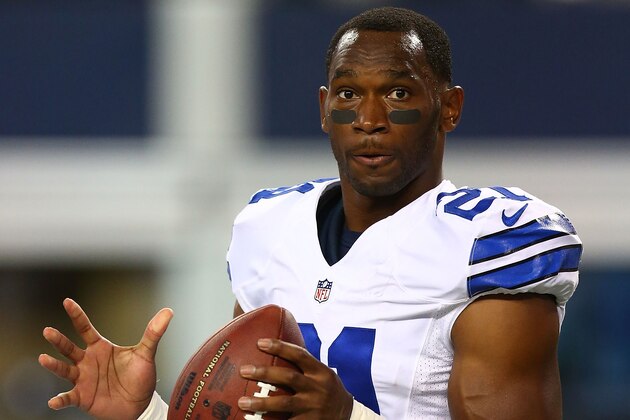 ARLINGTON, TX - AUGUST 16:  Joseph Randle #21 of the Dallas Cowboys prepares to throw the ball before the start of their preseason game against the Dallas Cowboys at AT&T Stadium on August 16, 2014 in Arlington, Texas.  (Photo by Ronald Martinez/Getty Images)
