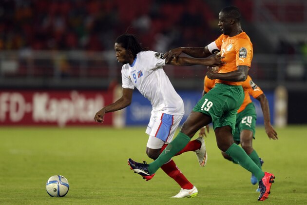 Congo's Diedonnei Mbokani, right, is challenged by Ivory Coast's captain Yaya Toure, right, during their African Cup of Nations semifinal soccer match in Bata, Equatorial Guinea, Wednesday, Feb. 4, 2015. (AP Photo/Themba Hadebe)