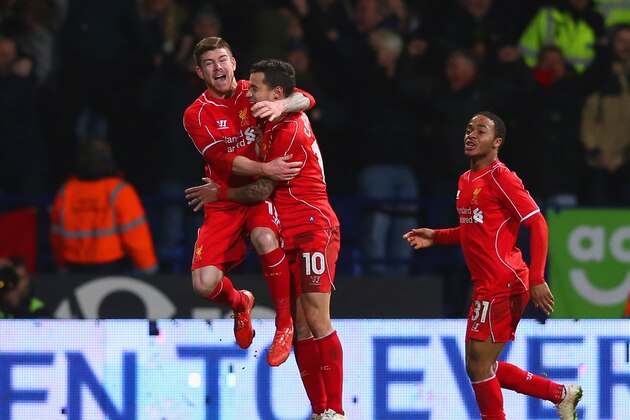 BOLTON, ENGLAND - FEBRUARY 04:  Philippe Coutinho of Liverpool celebrates scoring their second goal with Alberto Moreno and Raheem Sterling (R) of Liverpool during the FA Cup Fourth round replay between Bolton Wanderers and Liverpool at Macron Stadium on February 4, 2015 in Bolton, England.  (Photo by Alex Livesey/Getty Images)