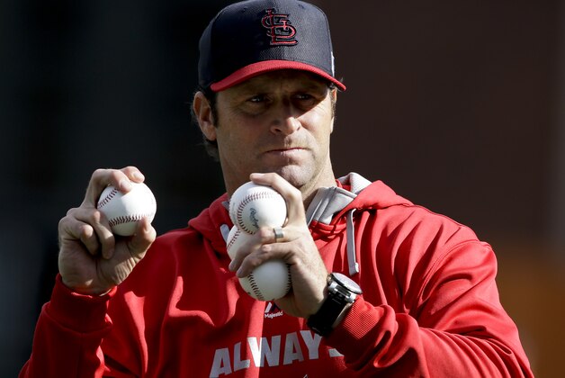 St. Louis Cardinals manager Mike Matheny throws batting practice before Game 5 of the National League baseball championship series against the San Francisco Giants Thursday, Oct. 16, 2014, in San Francisco. (AP Photo/Jeff Chiu)
