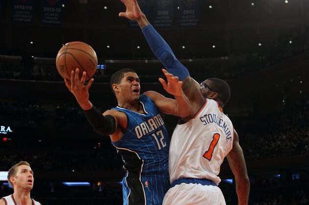 Nov 12, 2014; New York, NY, USA;  Orlando Magic forward Tobias Harris (12) drives to the basket against New York Knicks forward Amar'e Stoudemire (1)  in the first half at Madison Square Garden. Mandatory Credit: Noah K. Murray-USA TODAY Sports