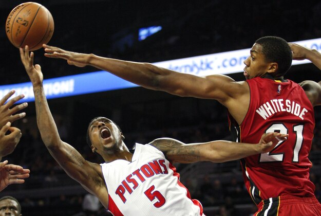 Feb 3, 2015; Auburn Hills, MI, USA; Detroit Pistons guard Kentavious Caldwell-Pope (5) attempts a shot over Miami Heat center Hassan Whiteside (21) during the third quarter at The Palace of Auburn Hills. Pistons beat the Heat 108-91. Mandatory Credit: Raj Mehta-USA TODAY Sports