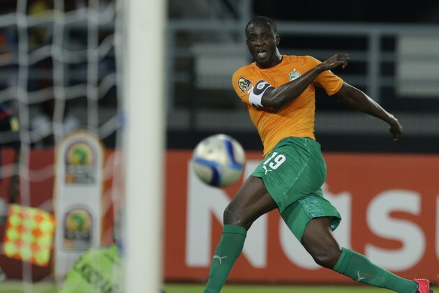 Ivory Coast's captain Yaya Toure, right, shoots at goal against Congo's goalkeeper Robert Muteba Kidiaba, left, during their African Cup of Nations semifinal soccer match in Bata, Equatorial Guinea, Wednesday, Feb. 4, 2015. (AP Photo/Themba Hadebe)