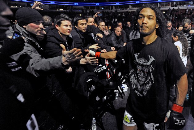 Benson Henderson celebrates with fans after defeating Josh Thomson during the main event of the UFC mixed martial arts match in Chicago, Saturday, Jan., 25, 2014. (AP Photo/Paul Beaty)