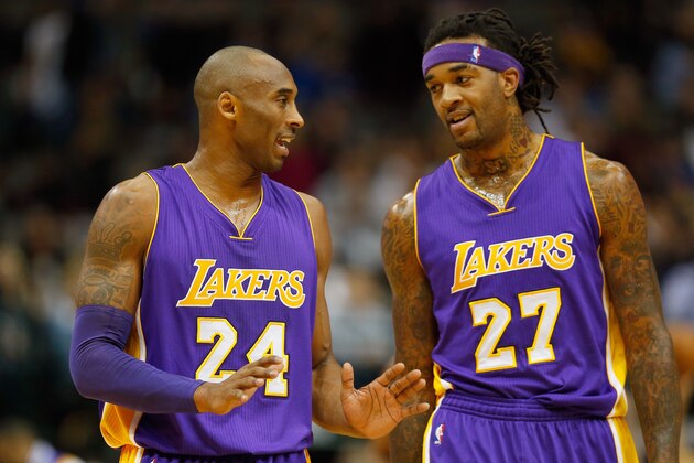 DALLAS, TX - NOVEMBER 21:  Kobe Bryant #24 of the Los Angeles Lakers talks with Jordan Hill #27 of the Los Angeles Lakers as the Lakers take on the Dallas Mavericks in the first quarter at American Airlines Center on November 21, 2014 in Dallas, Texas. NOTE TO USER: User expressly acknowledges and agrees that, by downloading and or using this photograph, User is consenting to the terms and conditions of the Getty Images License Agreement.  (Photo by Tom Pennington/Getty Images)
