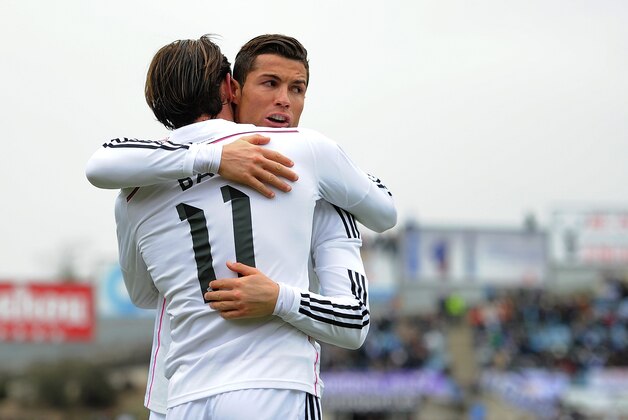 GETAFE, SPAIN - JANUARY 18:  Gareth Bale of Real Madrid celebrates with Cristiano Ronaldo after scoring his team's 2nd goal during the La Liga match between Getafe CF and Real Madrid CF at Coliseum Alfonso Perez stadium on January 18, 2015 in Getafe, Spain.  (Photo by Denis Doyle/Getty Images)
