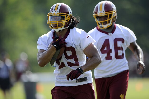 Washington Redskins running back Roy Helu, Jr. (29) runs a drill with Alfred Morris (46) during NFL football minicamp, Tuesday, June 17, 2014, in Ashburn, Va. (AP Photo/Nick Wass)