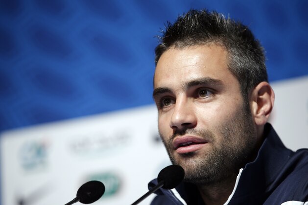 France's soccer player Loic Perrin answers a reporter during a press conference at the Clairefontaine training center, outside Paris, Friday, May 23, 2014. France are preparing for the upcoming soccer World Cup in Brazil starting on 12 June. (AP Photo/Christophe Ena)