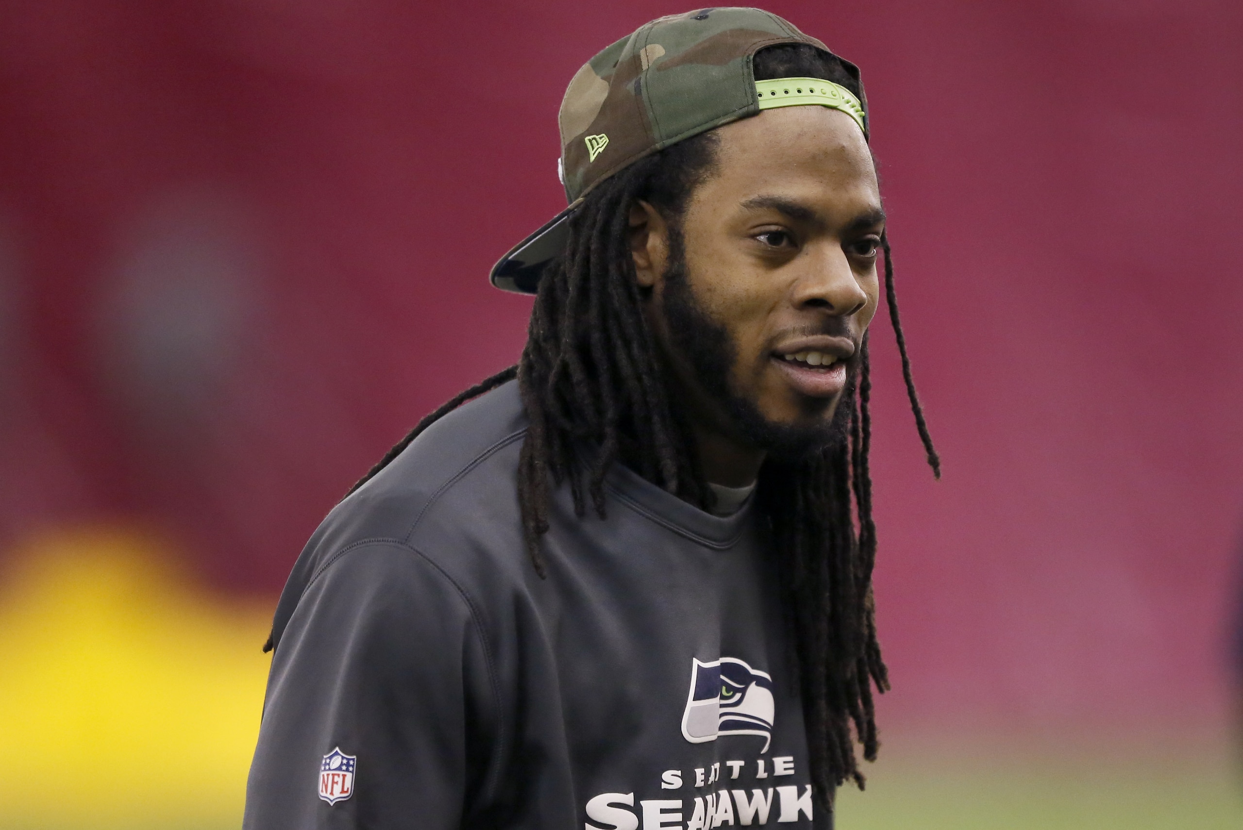 Seattle Seahawks' Richard Sherman arrives for a team walk through for NFL Super Bowl XLIX football game, Saturday, Jan. 31, 2015, in Tempe, Ariz. The Seahawks play the New England Patriots in Super Bowl XLIX on Sunday, Feb. 1, 2015. (AP Photo/Matt York)