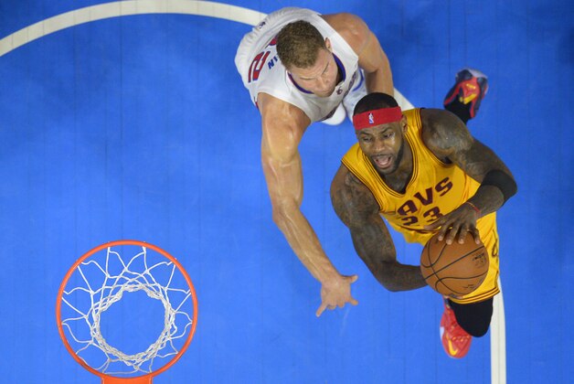 Cleveland Cavaliers forward LeBron James, right, goes up for a shot as Los Angeles Clippers forward Blake Griffin defends during the second half of an NBA basketball game, Friday, Jan. 16, 2015, in Los Angeles. The Cavaliers won 126-121. (AP Photo/Mark J. Terrill)