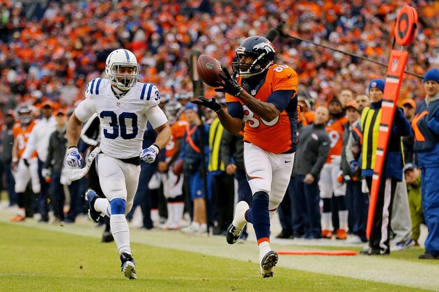 DENVER, CO - JANUARY 11:  Julius Thomas #80 of the Denver Broncos makes a catch in the first quarter as  LaRon Landry #30 of the Indianapolis Colts defends during a 2015 AFC Divisional Playoff game at Sports Authority Field at Mile High on January 11, 2015 in Denver, Colorado.  (Photo by Justin Edmonds/Getty Images)