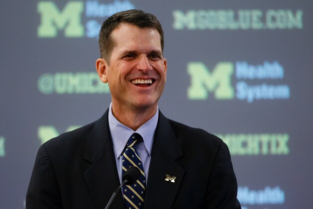 Dec 30, 2014; Ann Arbor, MI, USA; Jim Harbaugh speaks to the media as he is introduced as the new head football coach of the Michigan Wolverines at Jonge Center. Mandatory Credit: Rick Osentoski-USA TODAY Sports