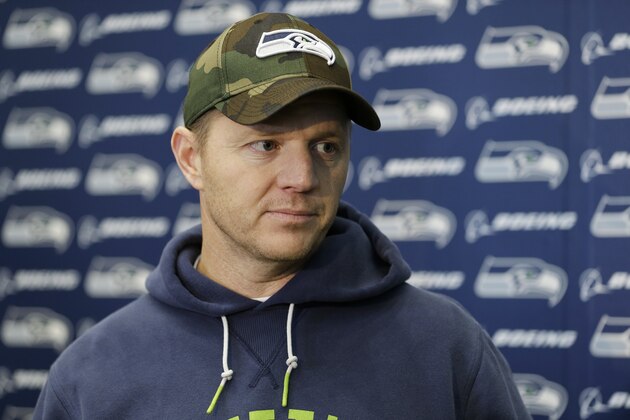 Seattle Seahawks offensive coordinator Darrell Bevell listens to a question as he talks to reporters Wednesday, Jan. 15, 2014, after NFL football practice in Renton, Wash. The Seahawks will play the San Francisco 49ers Sunday in the NFC championship. (AP Photo/Ted S. Warren)