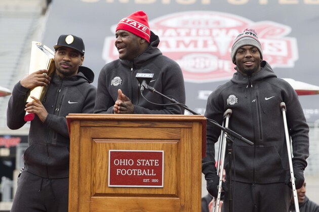 Jan 24, 2015; Columbus, OH, USA; Ohio State Buckeyes quarterback Cardale Jones (12) addresses the fans as fellow quarterbacks Braxton Miller (5) and J.T. Barrett (16) listen during the National Championship celebration at Ohio Stadium. Mandatory Credit: Greg Bartram-USA TODAY Sports
