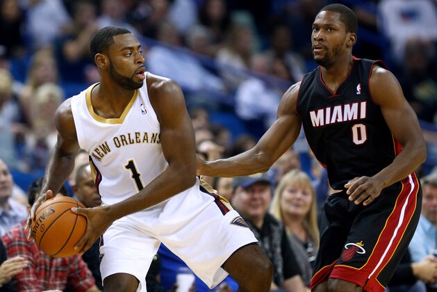 New Orleans Pelicans forward Tyreke Evans (1) drives against Miami Heat guard Toney Douglas (0) during an NBA basketball game in New Orleans, Saturday, March 22, 2014. The Pelicans won 105-95. (AP Photo/Jonathan Bachman)