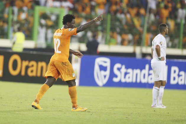 Ivory Coast's Wilfried Bony, left, celebrates after he scored a goal during their African Cup of Nations quarter final soccer match with Algeria at the Estadio De Malabo, Equatorial Guinea, Sunday, Feb. 1, 2015. (AP Photo/Sunday Alamba)
