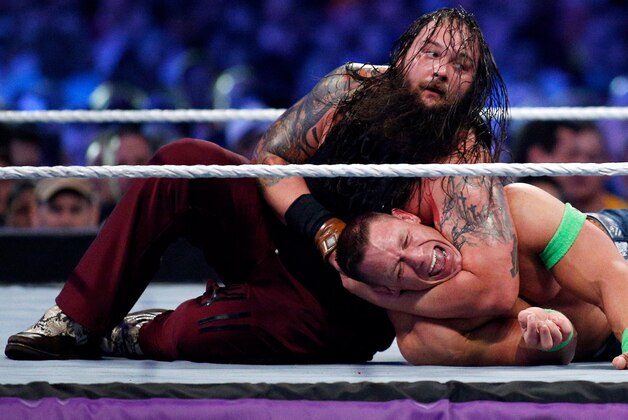 John Cena, right, and Bray Wyatt, left, compete during Wrestlemania XXX at the Mercedes-Benz Super Dome in New Orleans on Sunday, April 6, 2014. (Jonathan Bachman/AP Images for WWE)