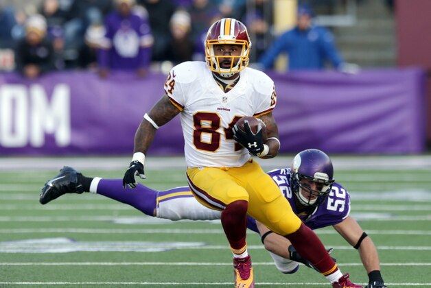 Washington Redskins tight end Niles Paul (84) evades a tackle by Minnesota Vikings outside linebacker Chad Greenway (52) during the second half of an NFL football game, Sunday, Nov. 2, 2014, in Minneapolis. (AP Photo/Jim Mone)