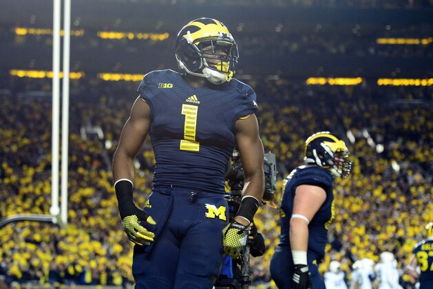Oct 11, 2014; Ann Arbor, MI, USA; Michigan Wolverines wide receiver Devin Funchess (1) celebrates with teammates after catching a pass for a touchdown during the first quarter against the Penn State Nittany Lions at Michigan Stadium. Mandatory Credit: Andrew Weber-USA TODAY Sports
