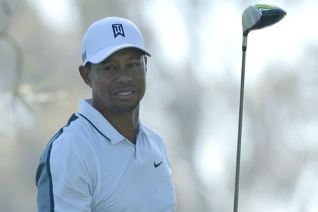 LA JOLLA, CA - FEBRUARY 05:  Tiger Woods reacts after hitting his tee shot into the rough on the 11th hole of the north course during the first round of the Farmers Insurance Open at Torrey Pines Golf Course on February 5, 2015 in La Jolla, California.  (Photo by Donald Miralle/Getty Images)