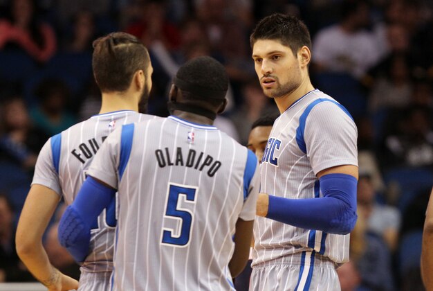 Dec 13, 2014; Orlando, FL, USA; Orlando Magic center Nikola Vucevic (9) talks with guard Evan Fournier (10) and guard Victor Oladipo (5) against the Atlanta Hawks during the second half at Amway Center. Orlando Magic defeated the Atlanta Hawks 100-99. Mandatory Credit: Kim Klement-USA TODAY Sports
