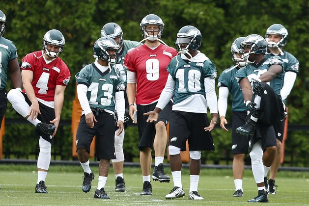 From left, Philadelphia Eagles' G.J. Kinne,  Damaris Johnson, Nick Foles, Jeremy Maclin, and LeSean McCoy run a drill at an NFL football organized team activity Thursday, May 29, 2014, in Philadelphia. (AP Photo/Matt Rourke)