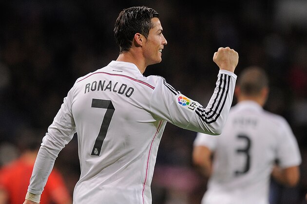 MADRID, SPAIN - DECEMBER 06:  Cristiano Ronaldo of Real Madrid celebrates after scoring Real's 3rd goal during the La Liga match between Real Madrid CF and Celta Vigo at Estadio Santiago Bernabeu on December 6, 2014 in Madrid, Spain.  (Photo by Denis Doyle/Getty Images)