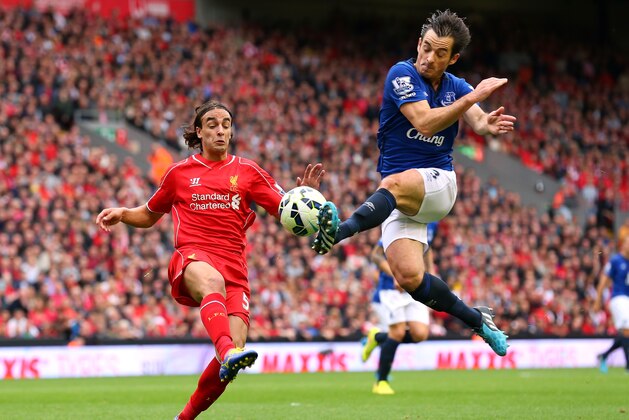 LIVERPOOL, ENGLAND - SEPTEMBER 27:  Leighton Baines of Everton tackles Lazar Markovic of Liverpool during the Barclays Premier League match between Liverpool and Everton at Anfield on September 27, 2014 in Liverpool, England.  (Photo by Alex Livesey/Getty Images)