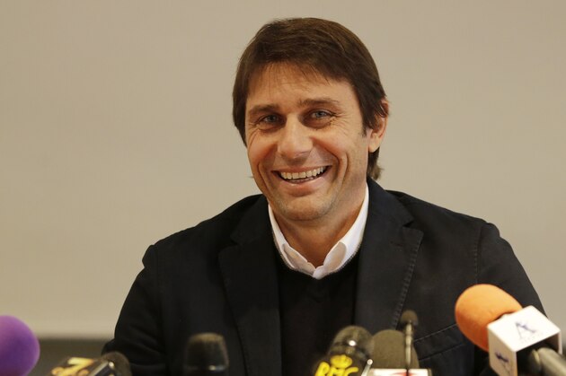 Italy coach Antonio Conte smiles during a press conference in Milan, Italy, Tuesday, Dec. 16, 2014. (AP Photo/Antonio Calanni)