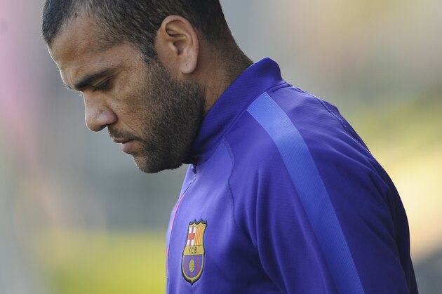 Barcelona's Dani Alves, from Brazil, looks down during a training session at the Sports Center FC Barcelona Joan Gamper in San Joan Despi, Spain, Saturday, Jan. 17, 2015. (AP Photo/Manu Fernandez)