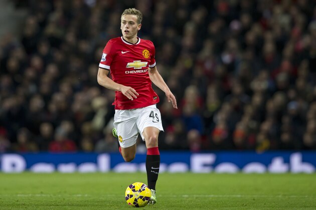 Manchester United's James Wilson during the English Premier League soccer match between Manchester United and Stoke City at Old Trafford Stadium, Manchester, England, Tuesday Dec. 2, 2014. (AP Photo/Jon Super)