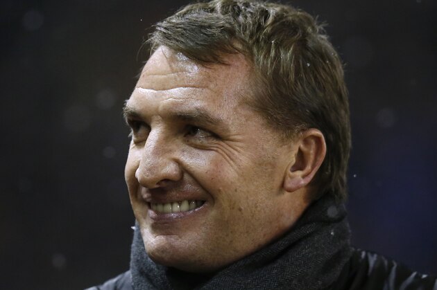 Liverpool's manager Brendan Rodgers smiles as he takes to the touchline before his team's Chelsea's during the English League Cup semi-final first leg soccer match between Liverpool and Chelsea at Anfield Stadium, Liverpool, England, Tuesday Jan. 20, 2015. (AP Photo/Jon Super)