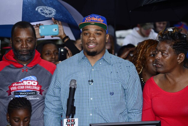 Feb 4, 2015; Glen Saint Mary, FL, USA; Ce Ce Jefferson signs with the University of Florida at his home near  Baker County High School  as his parents Leo and Annette Jefferson look on. Mandatory Credit: Richard Dole-USA TODAY Sports