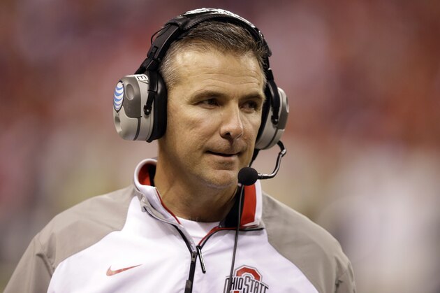 Ohio State head coach Urban Meyer watches from the sidelines during the second half of the Big Ten Conference championship NCAA college football game against Wisconsin Saturday, Dec. 6, 2014, in Indianapolis. (AP Photo/Darron Cummings)