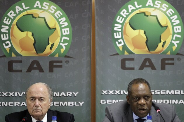 FILE - This is a Friday Feb. 10, 2012 file photo of  Confederation of African Football President Issa Hayatou, right, speaks as FIFA President Sepp Blatter, left, looks on during a joint press conference in Libreville, Gabon. FIFA vice president and African football head Issa Hayatou  denied allegations Sunday June 1, 2014  made against him by British newspaper The Sunday Times that he received favors for voting for Qatar to host the 2022 World Cup.  In a statement late Sunday night, the Confederation of African Football called the corruption allegations against its president “fanciful” and “ridiculous.”  (AP Photo/Themba Hadebe, File)