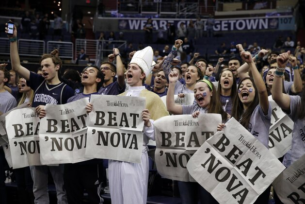 Georgetown fans cheer before an NCAA college basketball game against Villanova, Monday, Jan. 19, 2015, in Washington. Georgetown won 78-58. (AP Photo/Alex Brandon)