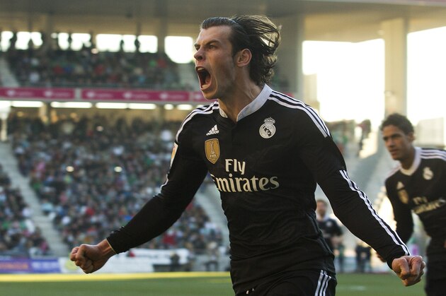 Real Madrid's Gareth Bale celebrates after scoring against Cordoba during their La Liga soccer match at the Arcangel stadium, in Cordoba, Spain on Saturday, Jan. 24, 2015. (AP Photo/Miguel Morenatti)