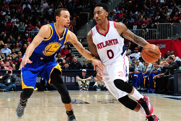 ATLANTA, GA - FEBRUARY 6: Jeff Teague #0 of the Atlanta Hawks drives against Stephen Curry #30 of the Golden State Warriors on February 6, 2015 at Philips Arena in Atlanta, Georgia.  NOTE TO USER: User expressly acknowledges and agrees that, by downloading and/or using this Photograph, user is consenting to the terms and conditions of the Getty Images License Agreement. Mandatory Copyright Notice: Copyright 2015 NBAE (Photo by Scott Cunningham/NBAE via Getty Images)