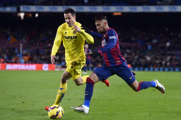 FC Barcelona's Neymar, from Brazil, right, against Villarreal's Mario Gaspar during a Spanish La Liga soccer match at the Camp Nou stadium in Barcelona, Spain, Sunday, Feb. 1, 2015. (AP Photo/Manu Fernandez)