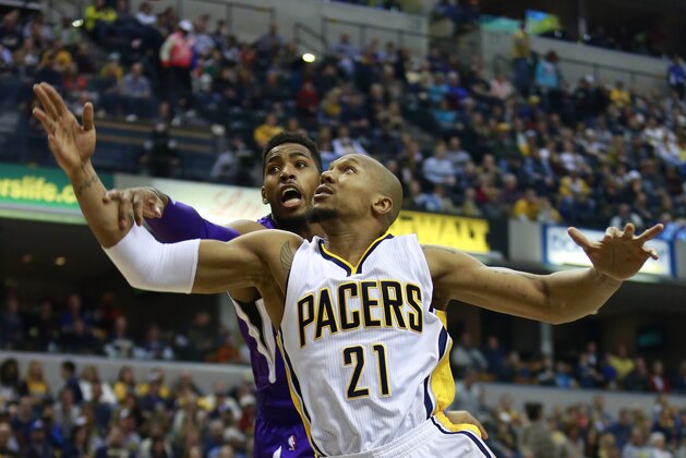 Indiana Pacers forward David West (21) battles for the basketball with Sacramento Kings forward Jason Thompson during the first half of an NBA basketball game, Saturday, Jan. 31, 2015, in Indianapolis. (AP Photo/R Brent Smith)