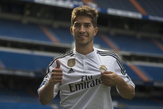 Brazilian international soccer player Lucas Silva, poses for photographers during his official presentation at the Santiago Bernabeu stadium in Madrid, Spain, Monday, Jan. 26, 2015, after signing for Real Madrid. (AP Photo/Andres Kudacki)